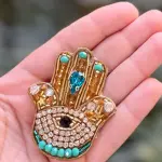 The Golden Hamsa Protection magnet Pin