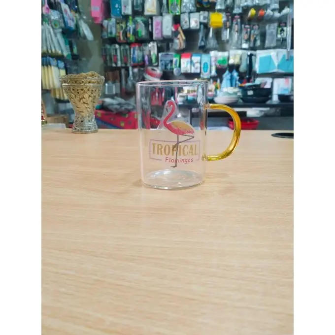 A flamingo-themed thermal glass mug, perfect for your summer drinks.