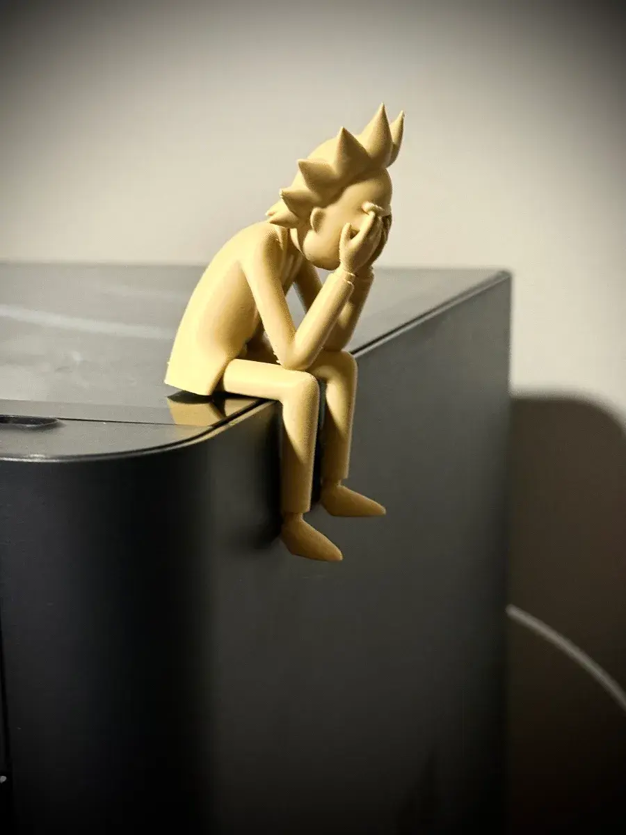 Sad Rick Sanchez Sitting on a Ledge Figurine