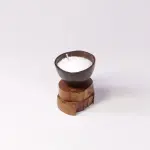 Compact Coconut Shell Candle on Rustic Two-Tier Wood Slice Base