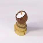 Coconut Shell Candle with Wooden Wick on Stacked Wood Base